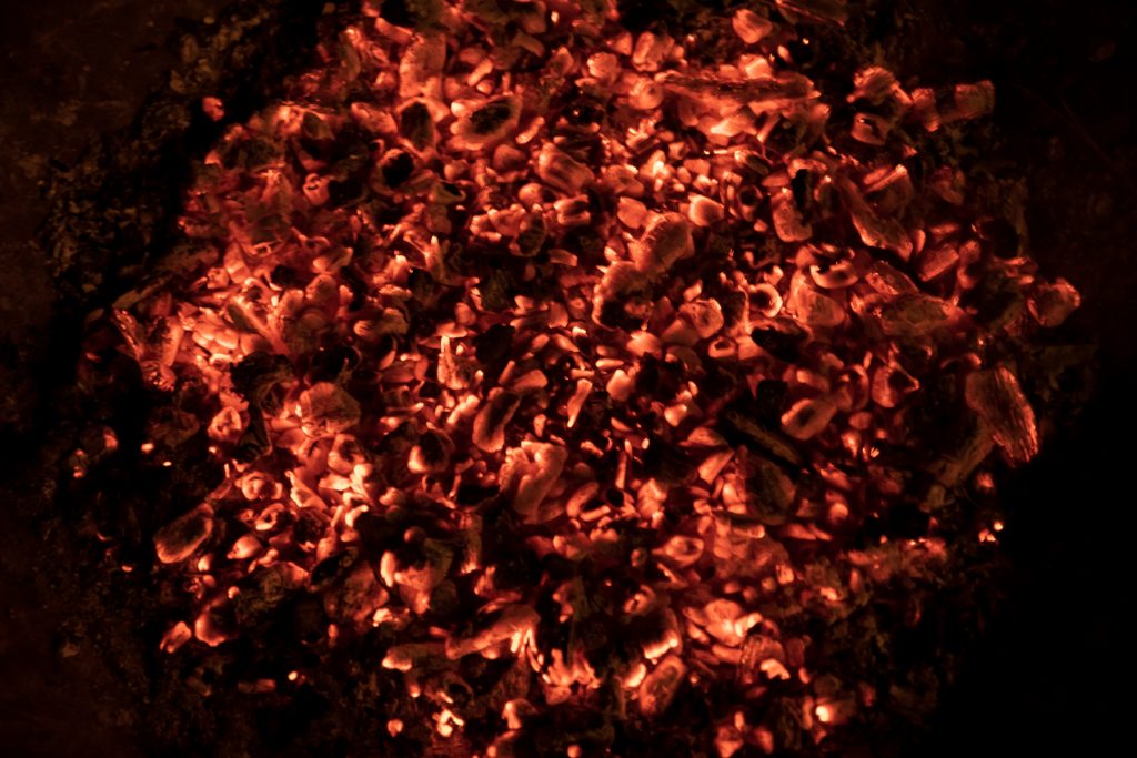 Campfire embers glowing orange.