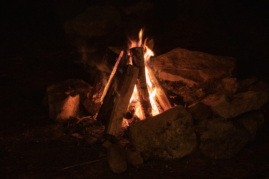 A cone-shaped campfire. 