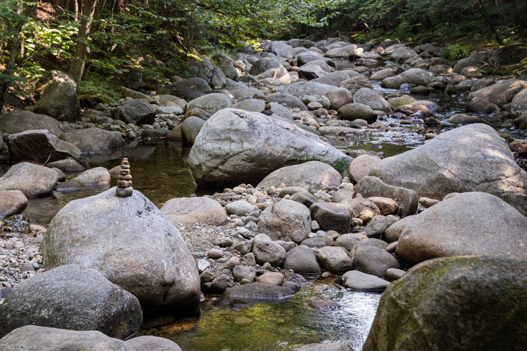 Stones in a babbling brook in White Mountain National Forest at the Lost River Valley Campground in North Woodstock, New Hampshire.