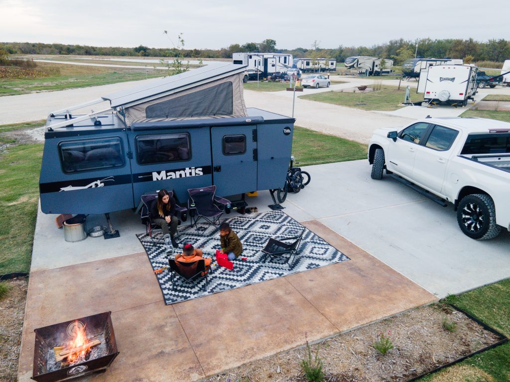 Photo of Campspot Ambassador with her family outside of RV