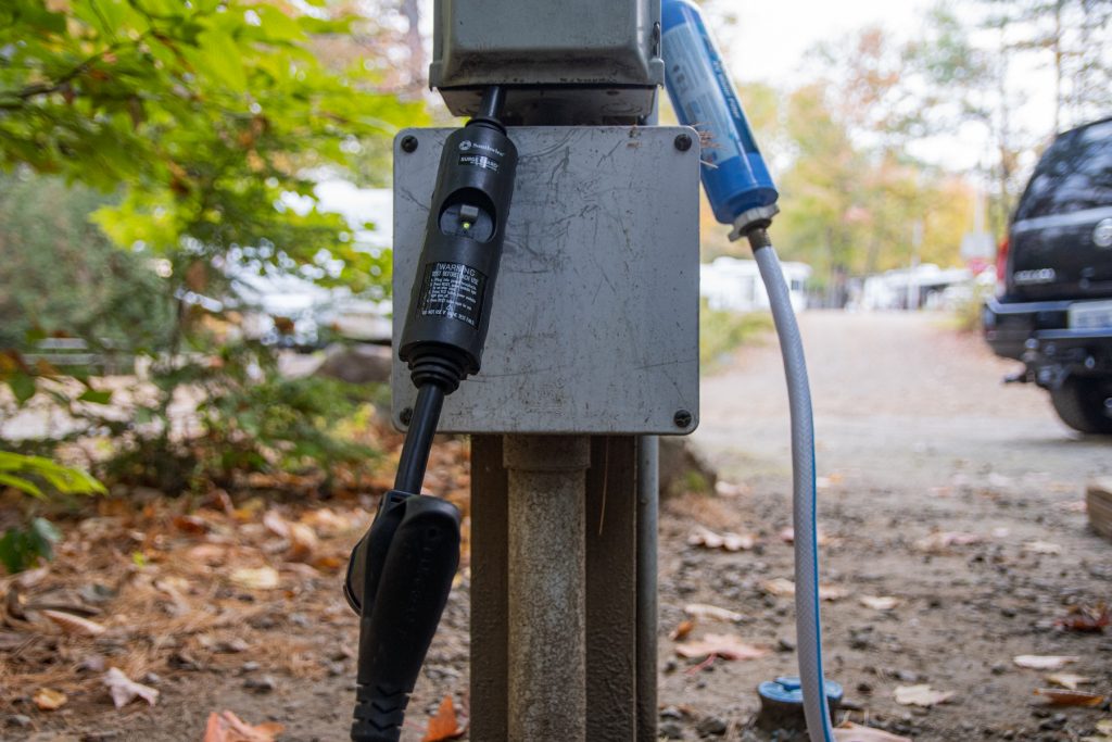 A surge protector connected to the power cord of an RV. 