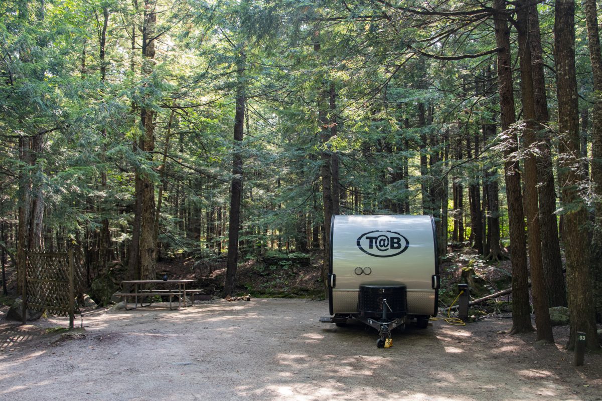 A teardrop camper sits at a brookside campsite at Lost River Valley Family Campground in North Woodstock, New Hampshire. Teardrop campers are smaller RVs that can be towed by a variety of vehicles.