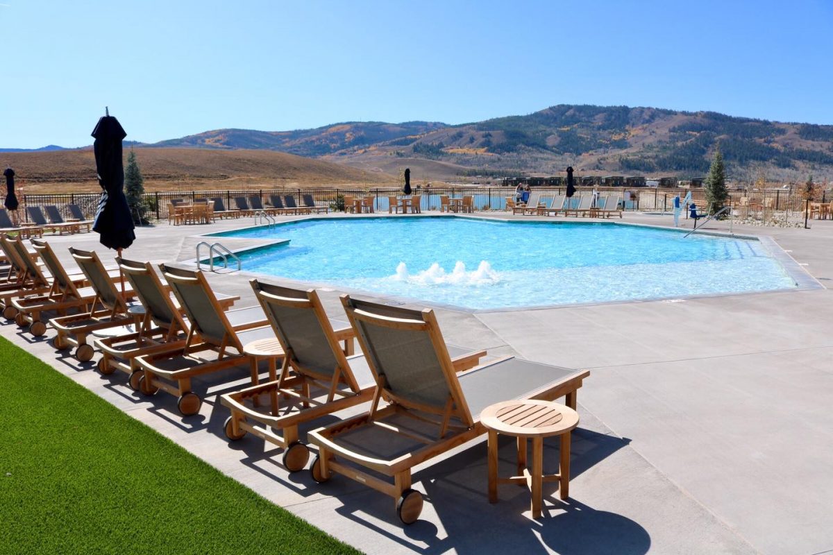 Pool with loungers overlooking Rocky Mountains