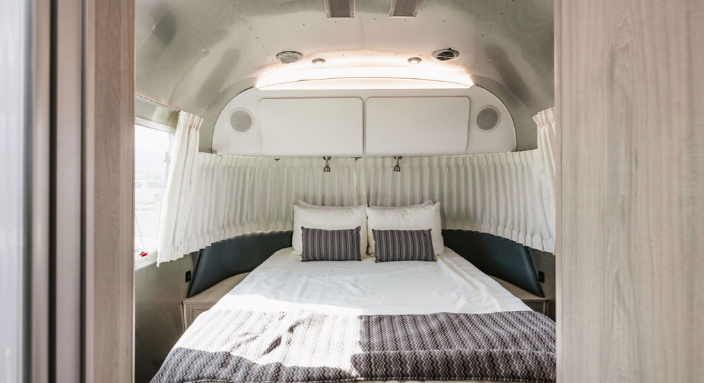 Queen bed inside Globtrotter Airstream