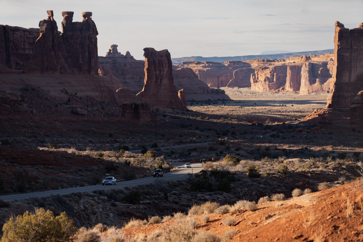 Red rock formations and fins cast shadows across Arches National Park in Moab, Utah.