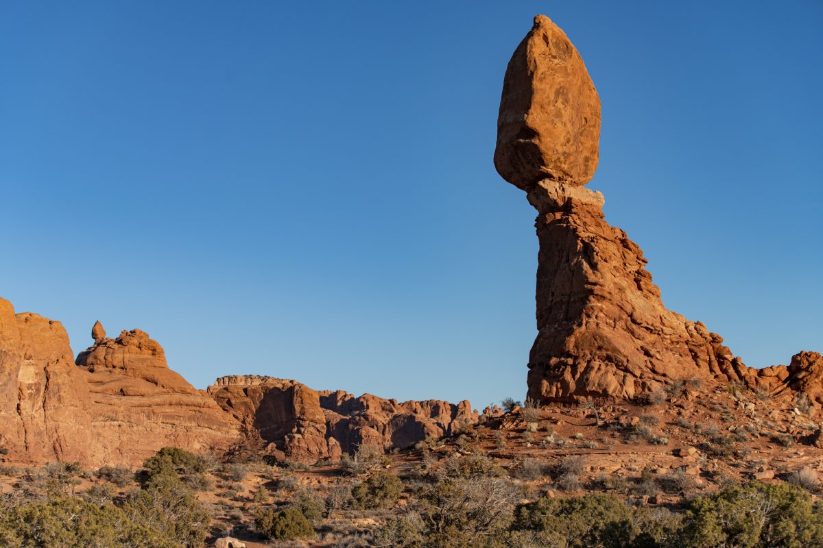 The sun begins to set on Balanced Rock in Arches National Park in Moab, Utah. 