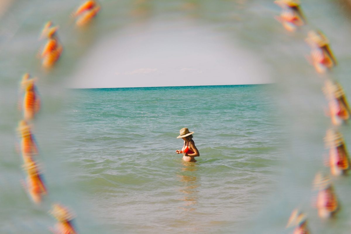 A pregnant woman swimming in Lake Michigan.