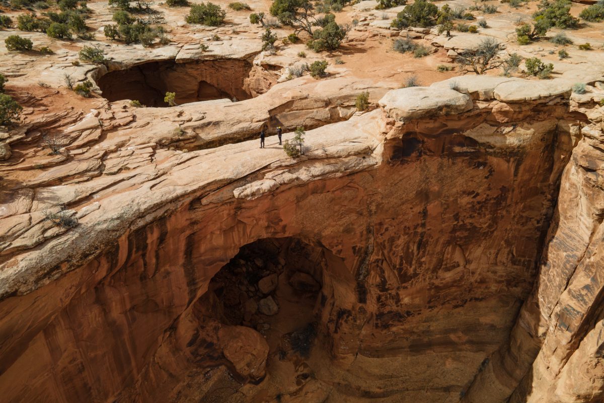 A striking aerial view of the Gemini Bridges in Moab, Utah.