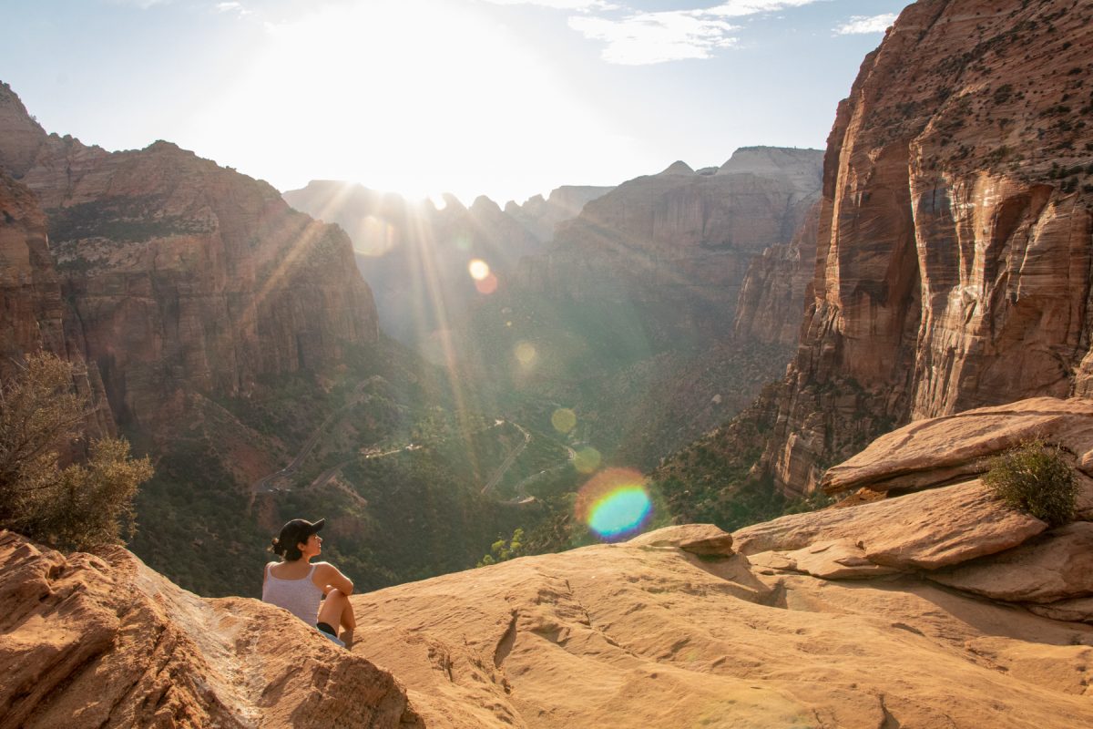 A woman looks out to the canyon at Zion National Park in Utah.