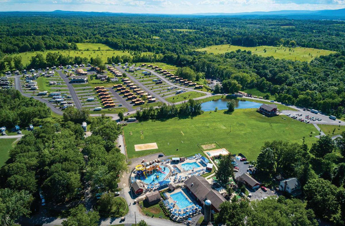 Ariel shot of Gardiner with water park and RV campground surrounded by lush woods