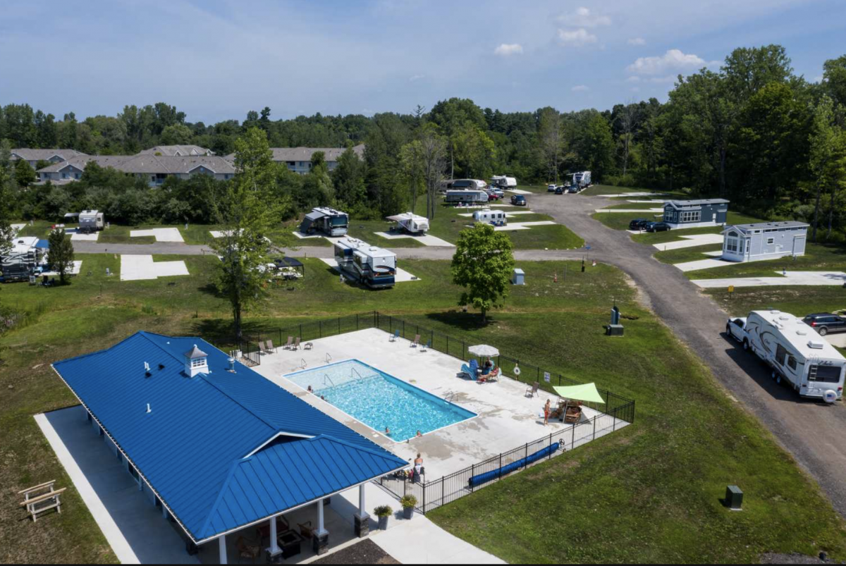 Pool area with RV sites at Hidden Ponds RV Resort