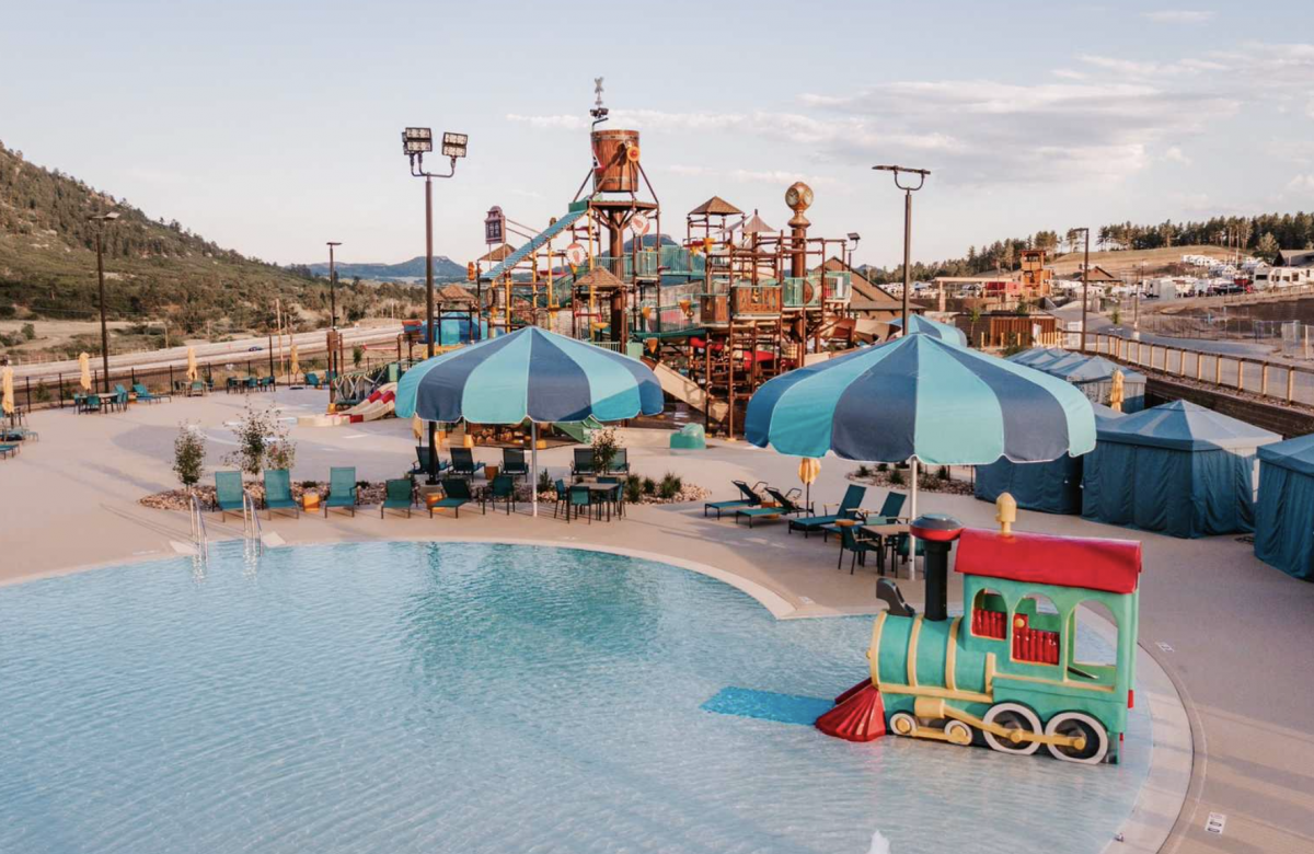 Pool area with water zone at Yogi Bear's Jellystone Park Larkspur.