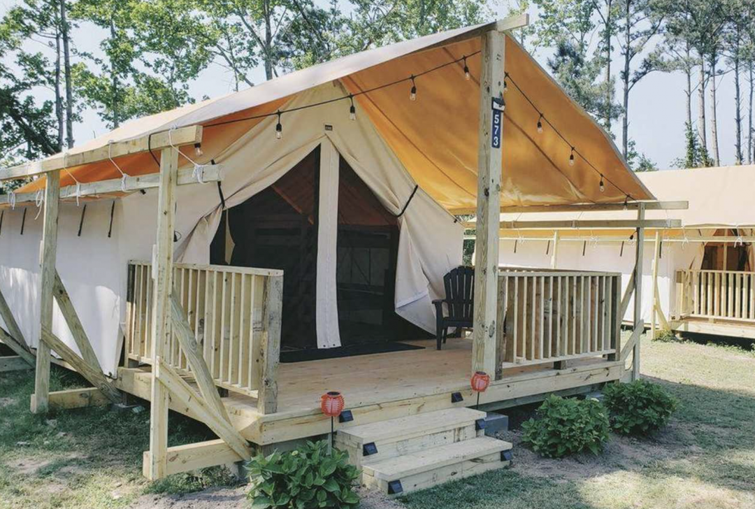 Glamping tent with lights and porch at Lovers Way in West Virginia.