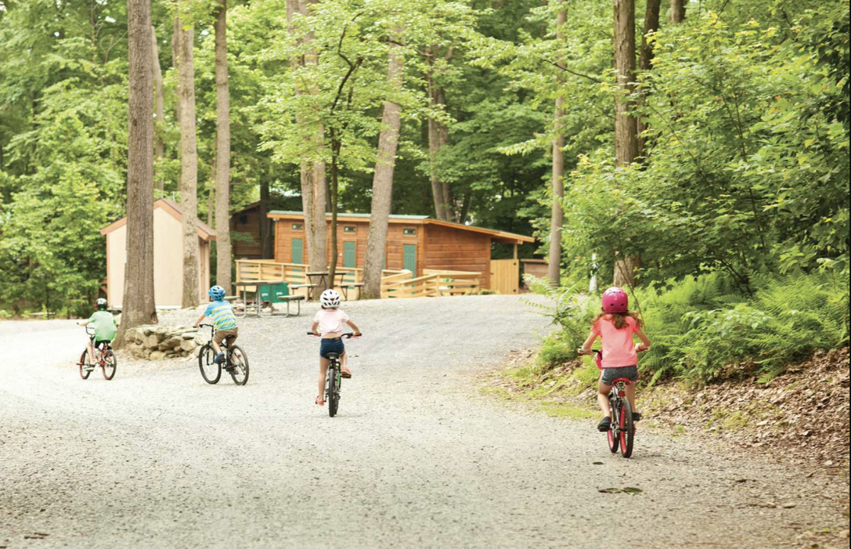 Photo of kids riding their bikes at Yogi Bear's Jellystone Park: Quarryville. 