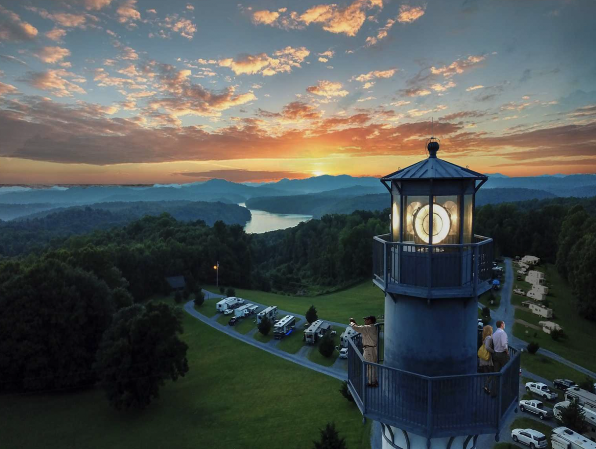 Lighthouse and RVs at sunset