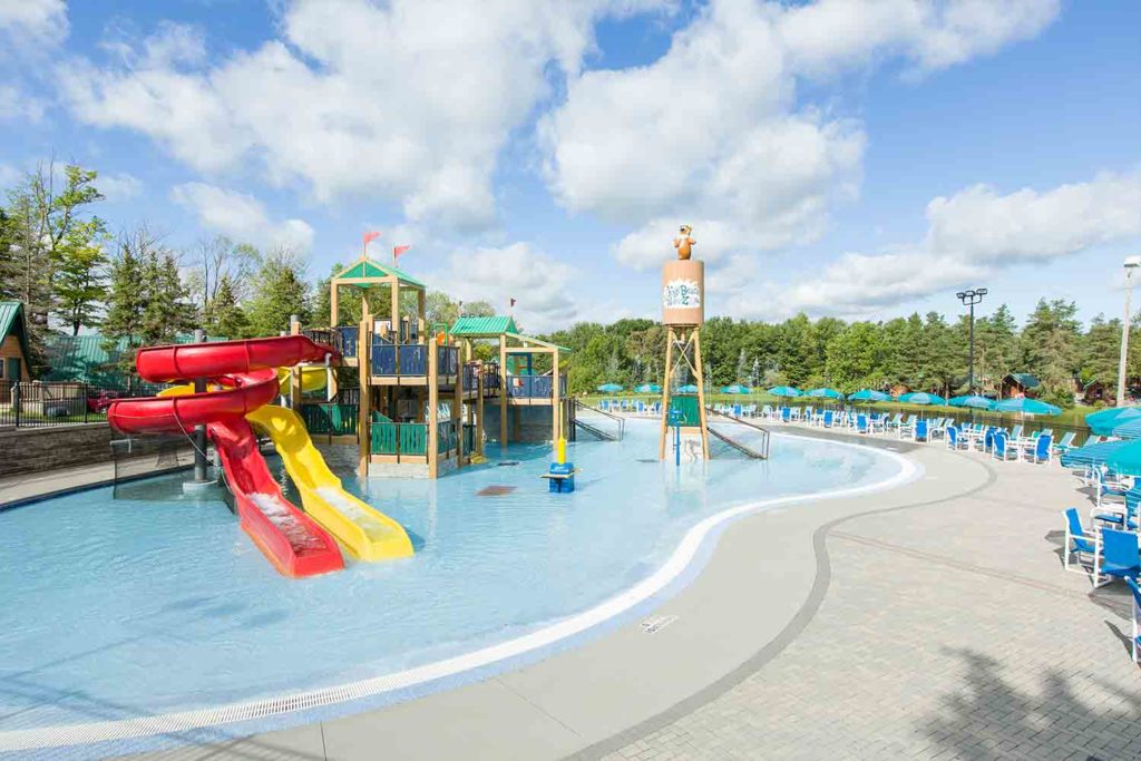 Pool and Water Zone with water slides at Yogi Bear's Jellystone Park Camp-Resort in Western New York.