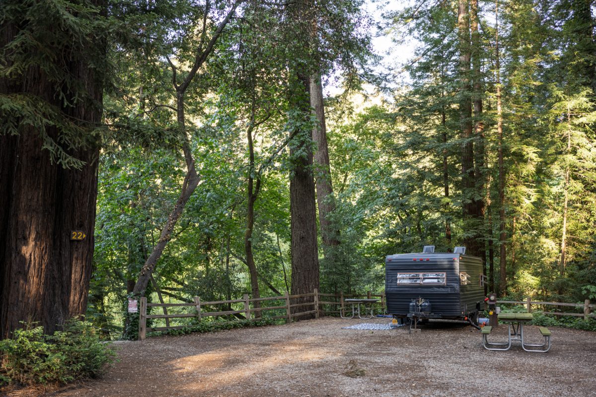 An RV parked at an RV site at the Santa Cruz Redwoods RV Resort in Felton, CA.