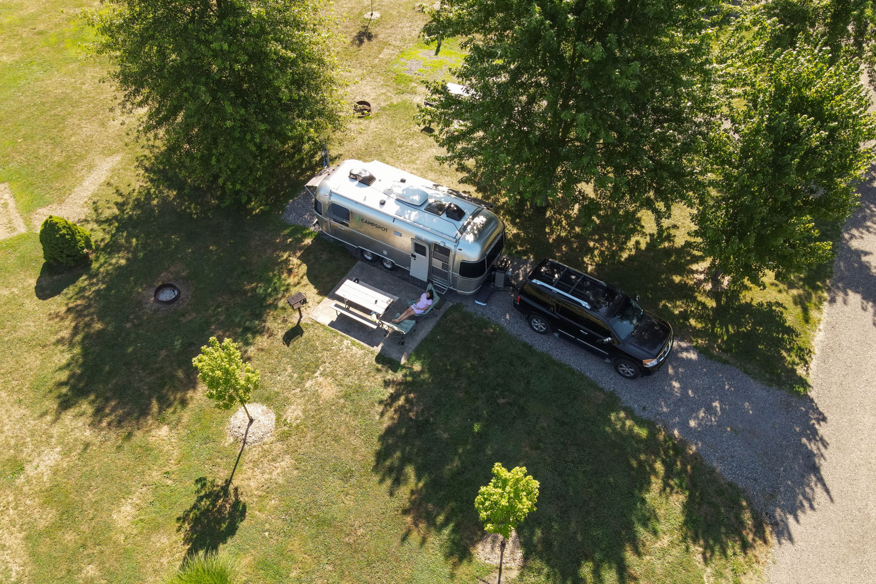 An Airstream trailer backed into a campsite at Yogi Bear's Jellystone Park in Akron / Canton, Ohio.