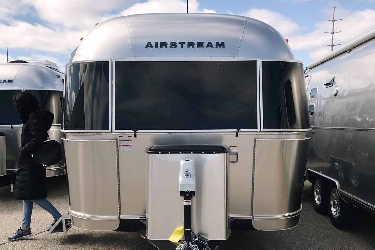 A woman walks out of an Airstream trailer at an Airstream Dealership in Grand Rapids, Michigan.