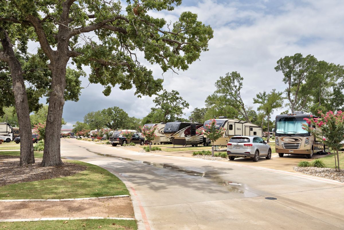 RVs parked in their campsites at Oak Forest RV Resort in Austin, Texas.