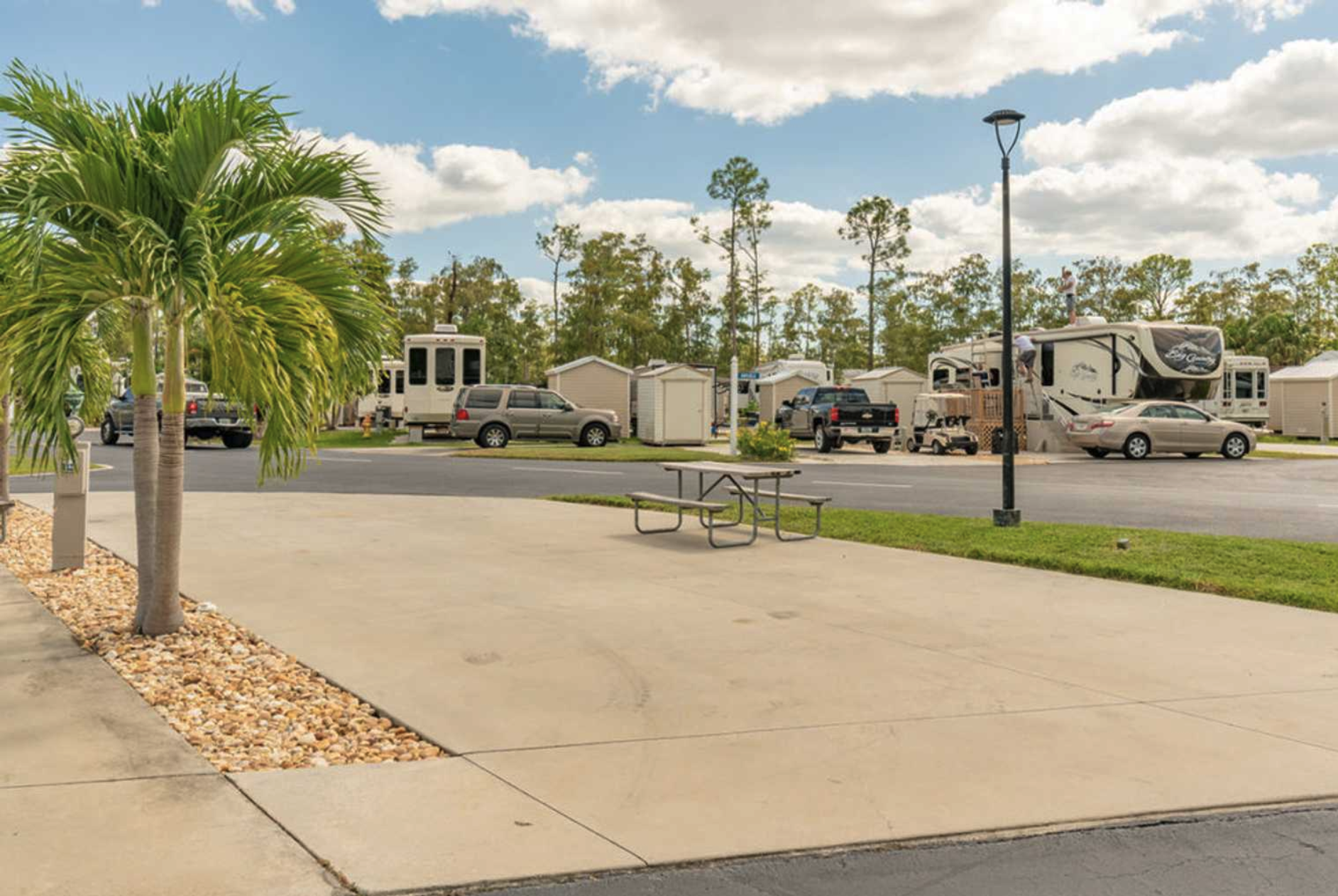 An RV site at Club Naples RV Resort in Naples, Florida