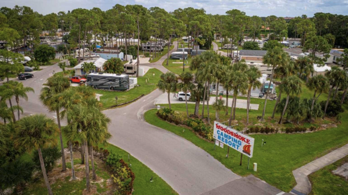 The entryway to Woodsmoke Camping Resort in Fort Myers, Florida