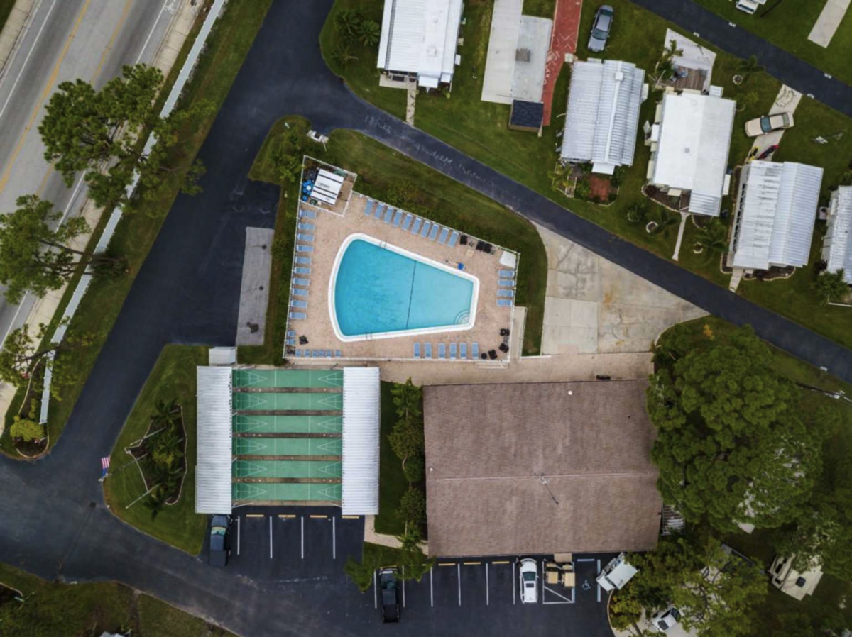 Pool and shuffle board area of Arbor Terrace RV Resort in Bradenton, Florida