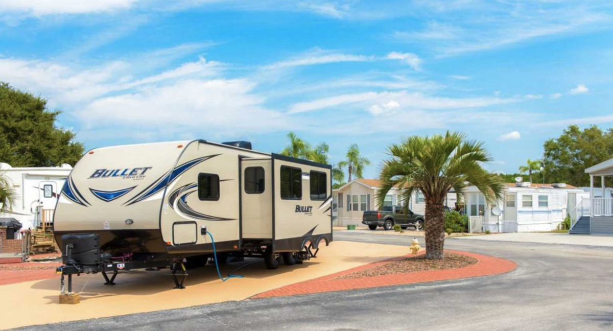 An RV parked in an RV site at Three Lakes RV Resort in Hudson, Florida