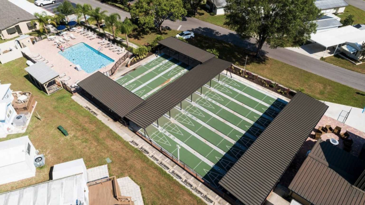 The pool and shuffle board area of Baker Acres RV Resort (55+) in Zephyrhills, Florida