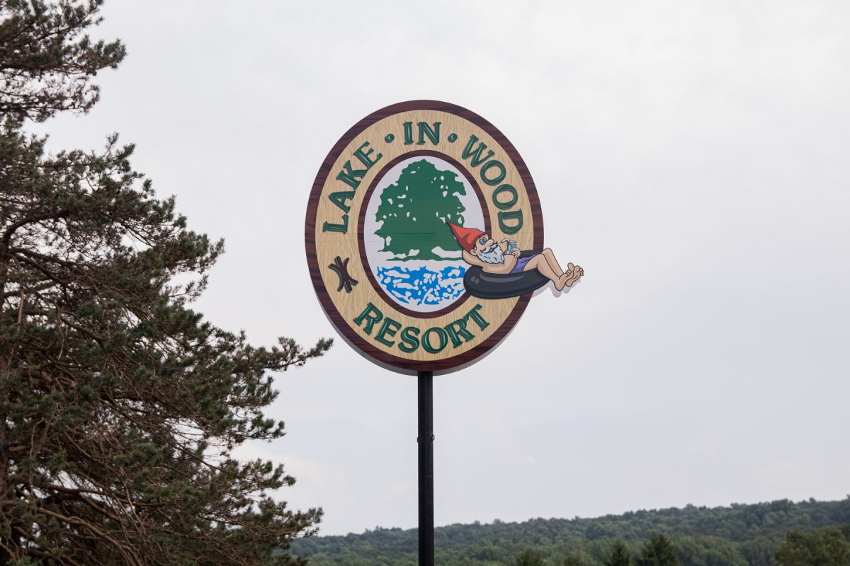 The sign of Lake in Wood RV Resort in Narvon, Pennsylvania with a Gnome as the resort is gnome-themed.