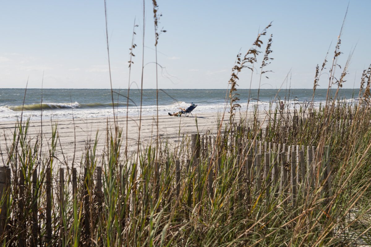 A person lounges on a beach chair along the Atlantic Ocean Myrtle Beach in South Carolina.