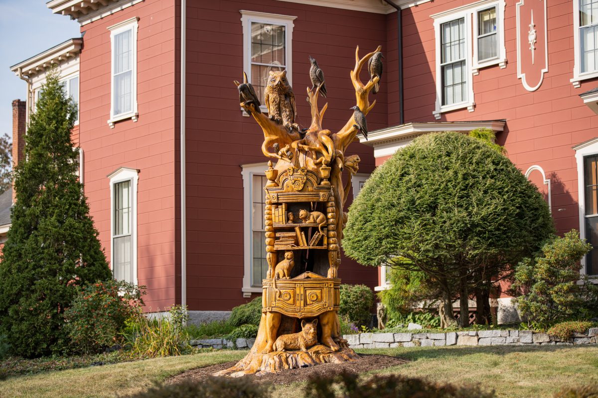 The statue carved from a dead ash tree in front of Stephen King's house in Bangor, Maine.