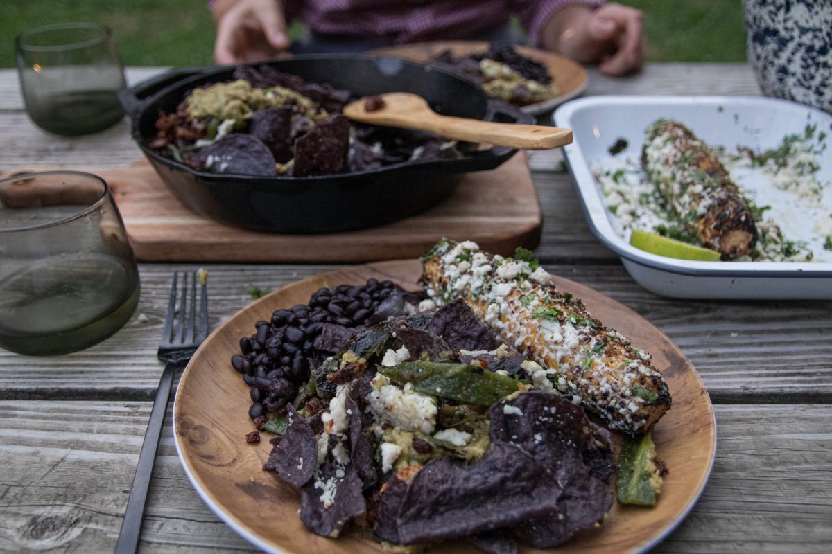 Campfire nachos with black beans and Mexican street corn.