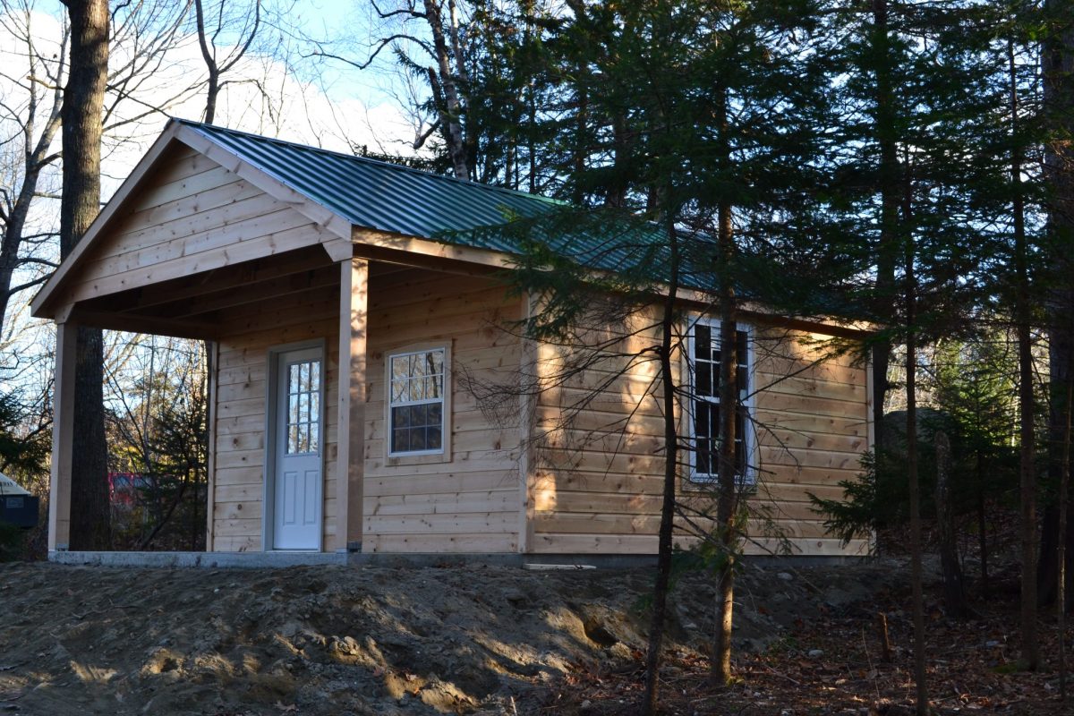 A cabin situated in the woods at Hadley's Point Campground in Bar Harbor, Maine.