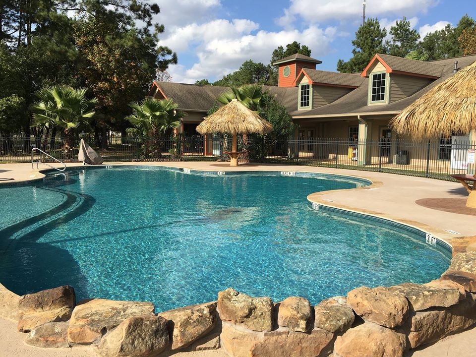 Rayford Crossing RV Resort in Spring, Texas, pool and relaxation area.