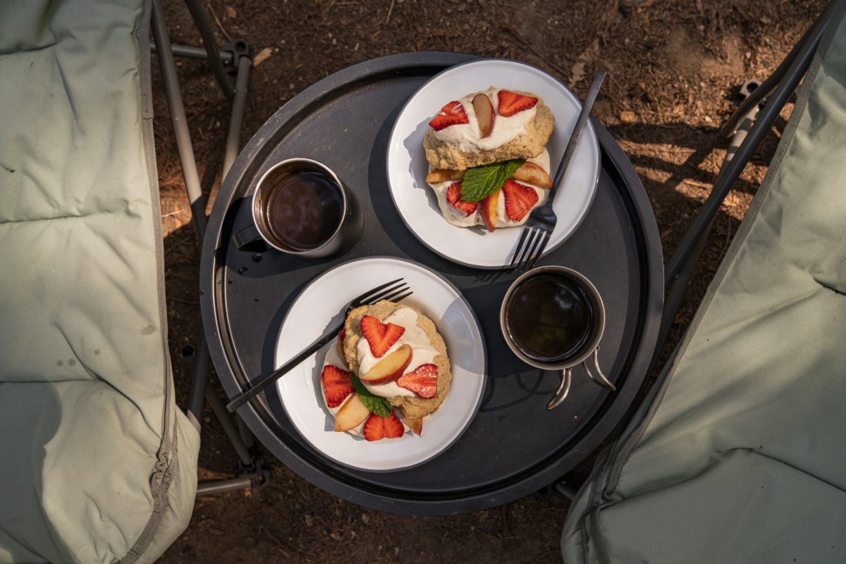 Peach and strawberry shortcake next to cups of coffee at a campsite at the Santa Cruz Redwoods RV Resort in Felton, California near Santa Cruz, California.