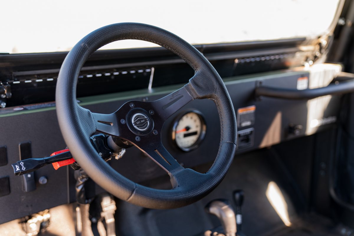 The wheel and inside of a ROXOR off-road vehicle.