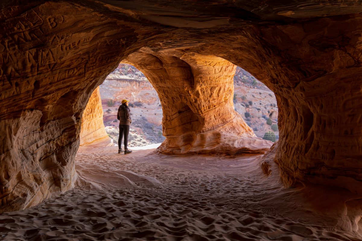 A woman looks out from the sand caves located near Kanab, Utah.