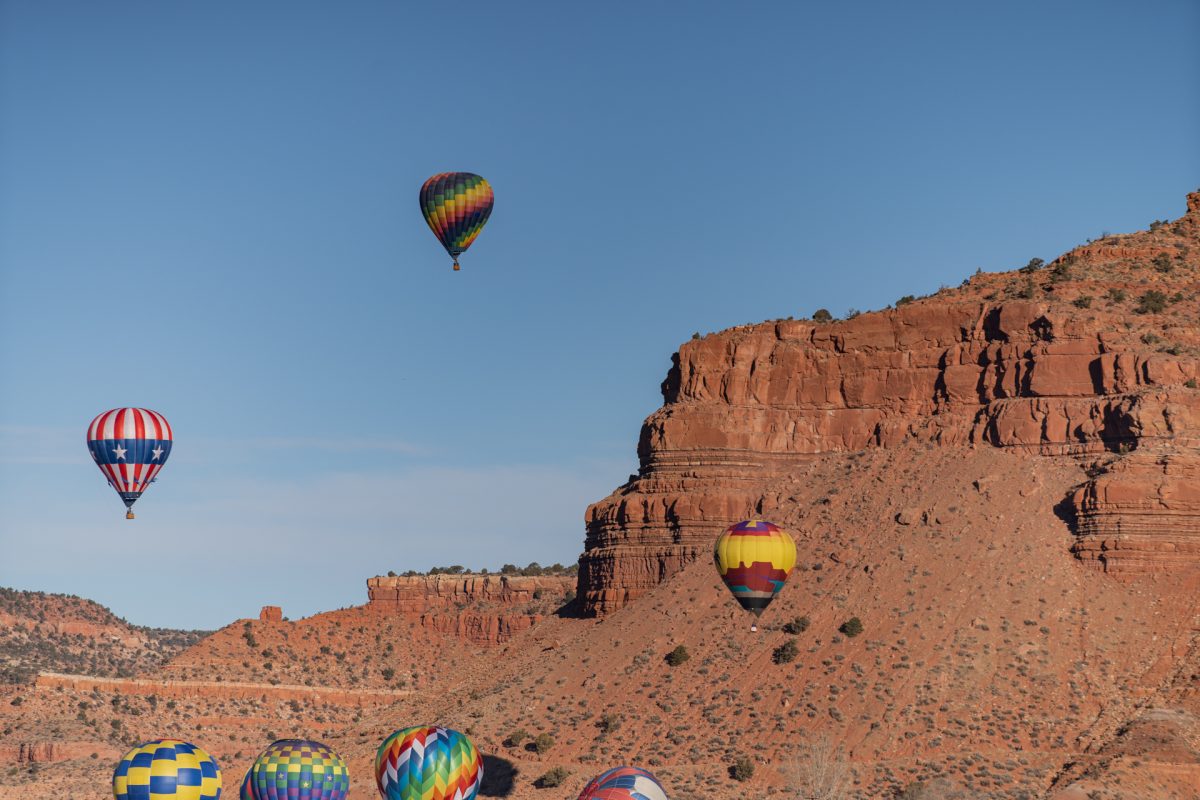 Hot air balloons against the Vermillion cliffs located in Kanab, Utah. The Balloons and Tunes Roundup is a fun thing to do in Kanab, Utah.