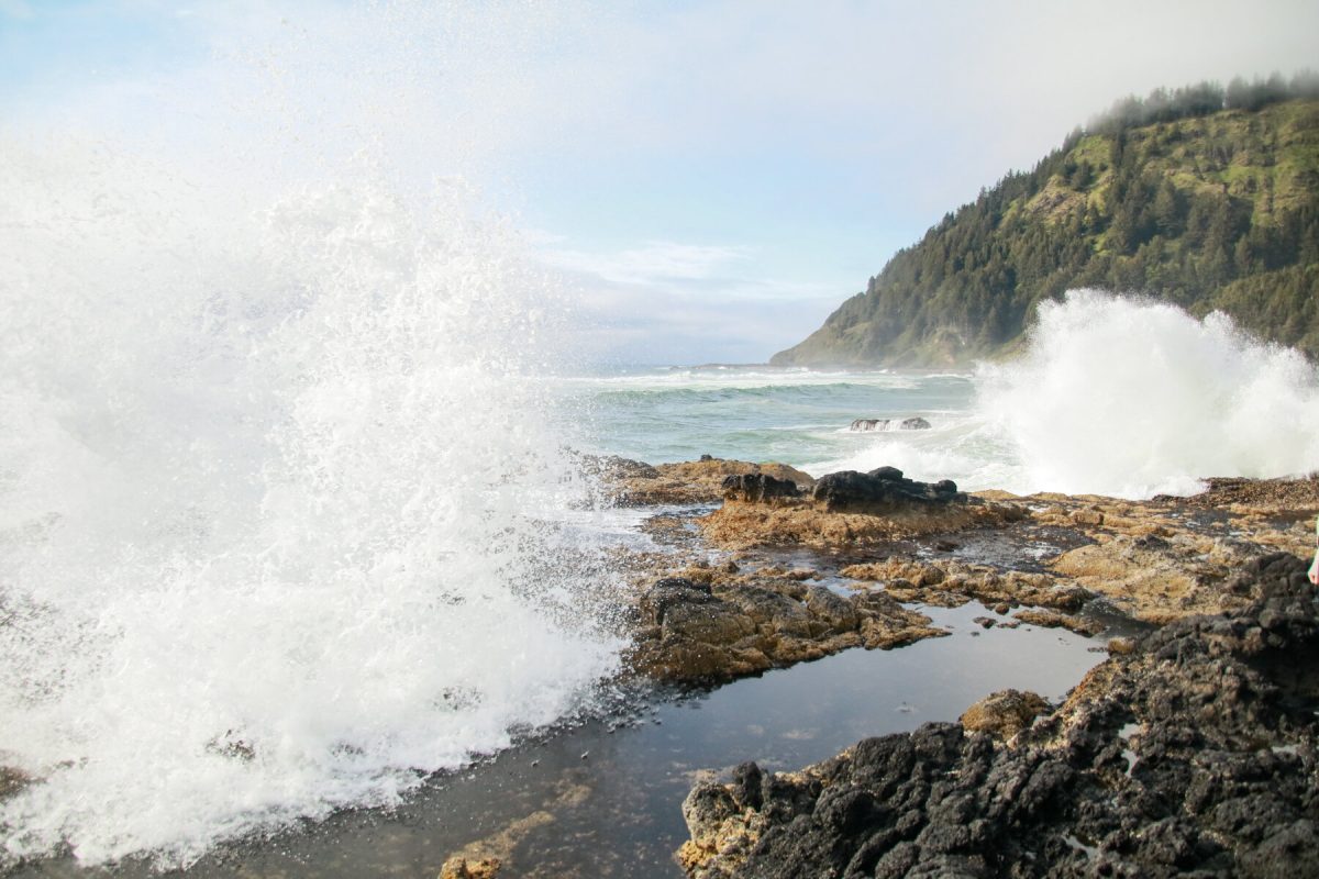 Sea water splashes through Thor's Well, a popular sight along the Oregon coast, a favorite Oregon camping destination.