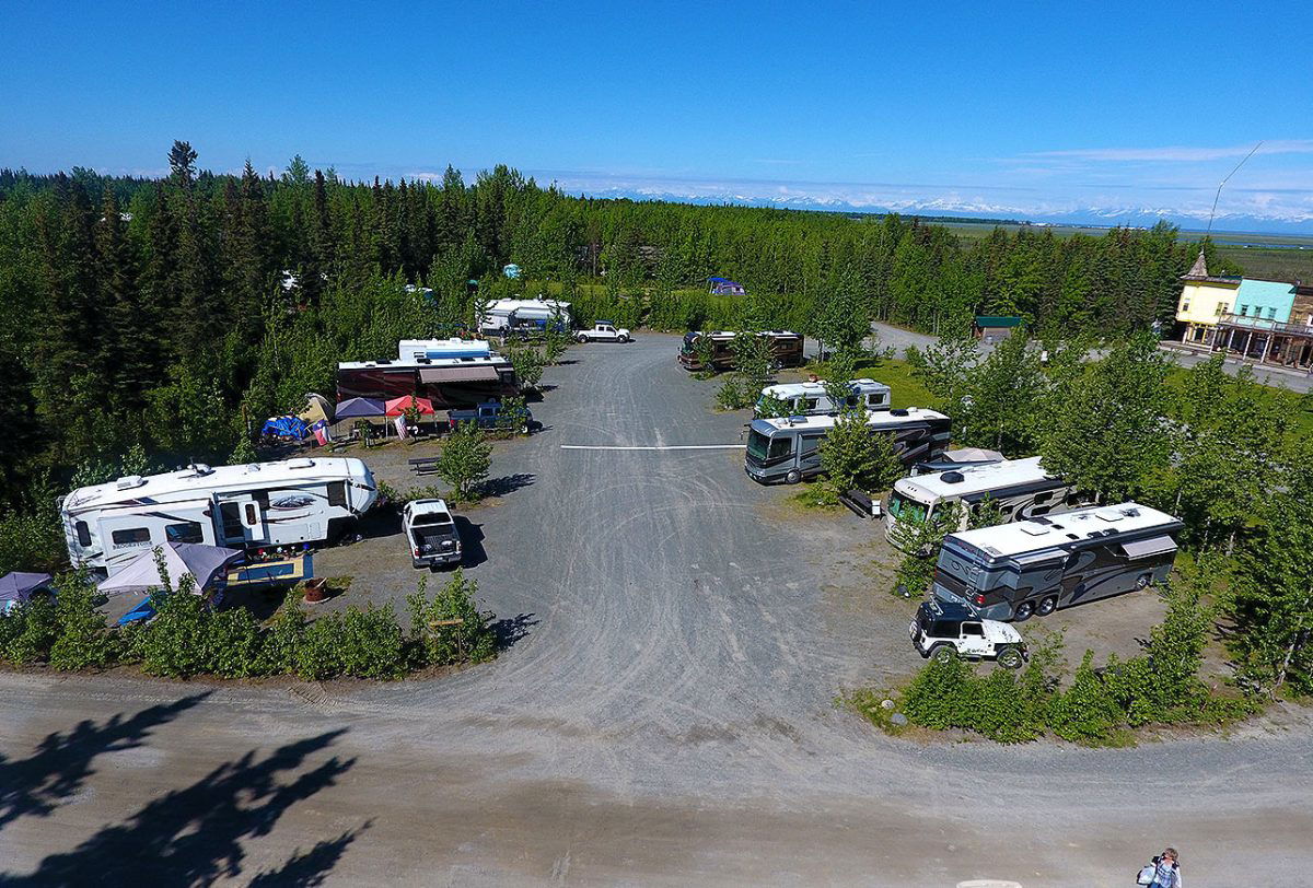 Aerial view of alaskan campground with RVs parked between trees