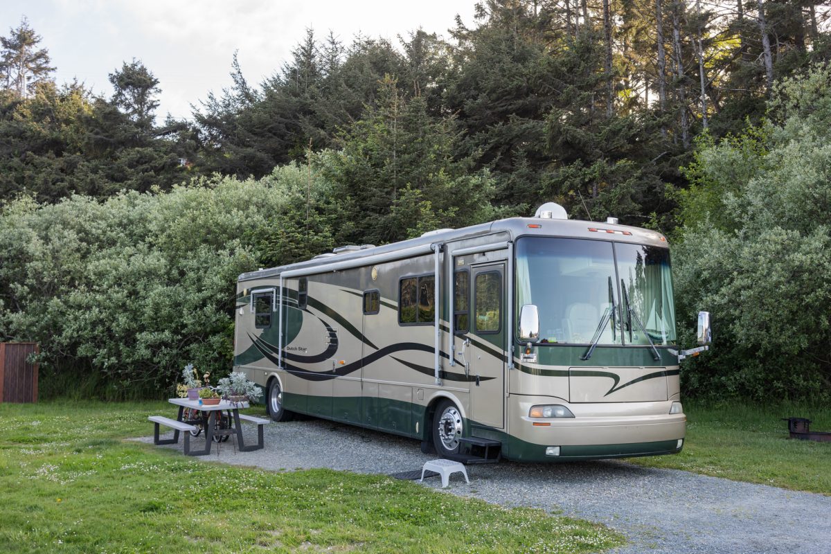 An RV parked at a back-in RV site at Oceanside RV Resort and Campground in Coos Bay, Oregon.