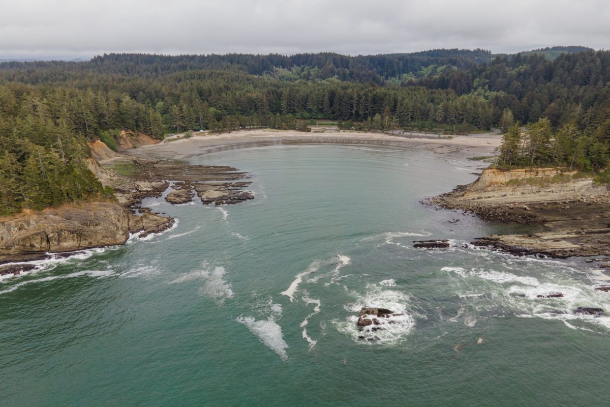 An aerial view of Sunset Beach at Sunset Bay State Park near Coos Bay, an Oregon camping destination.