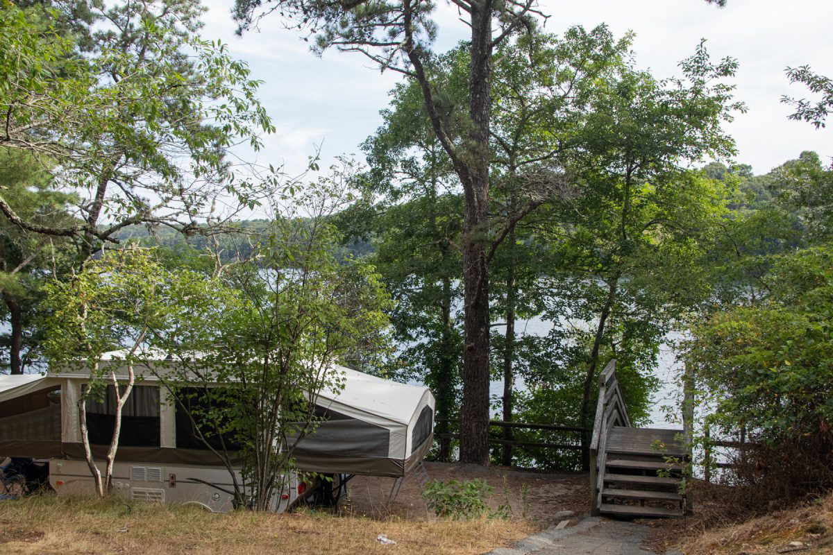 Pop-up camper next to the water at Peter's Pond RV Resort