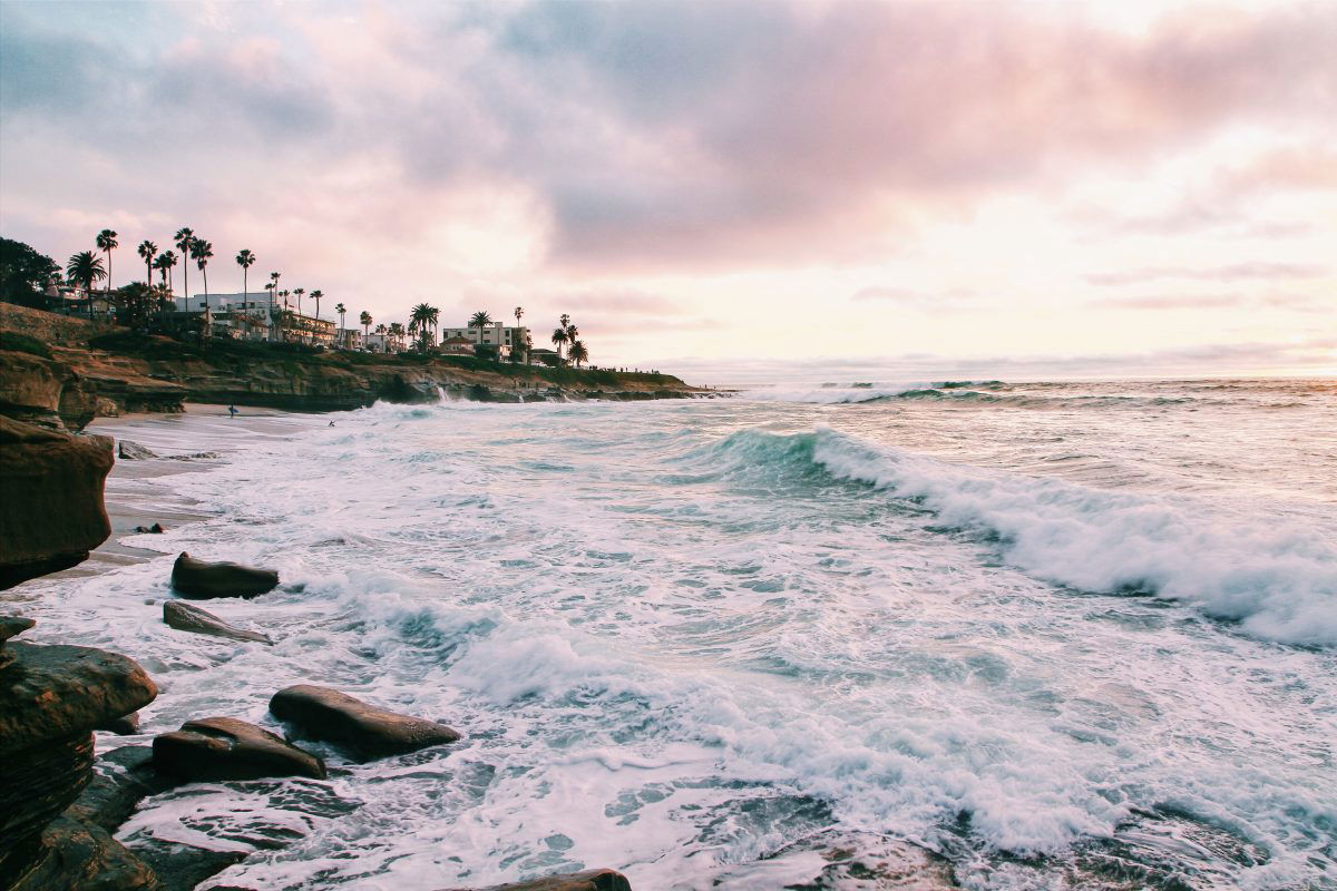 View of ocean and pink sunset in San Diego, CA