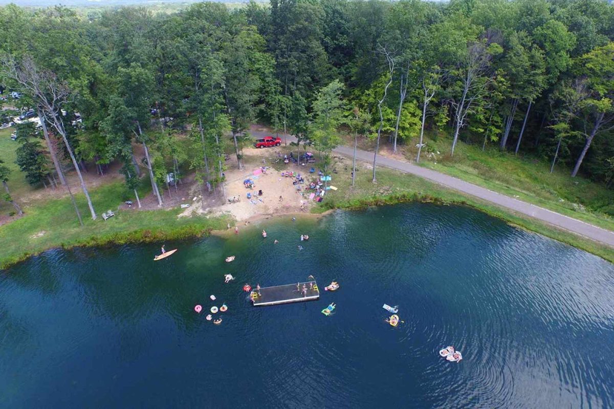 An aerial shot of the pond at Tripods Family Camp Resort, a popular destination for fishing with kids. 