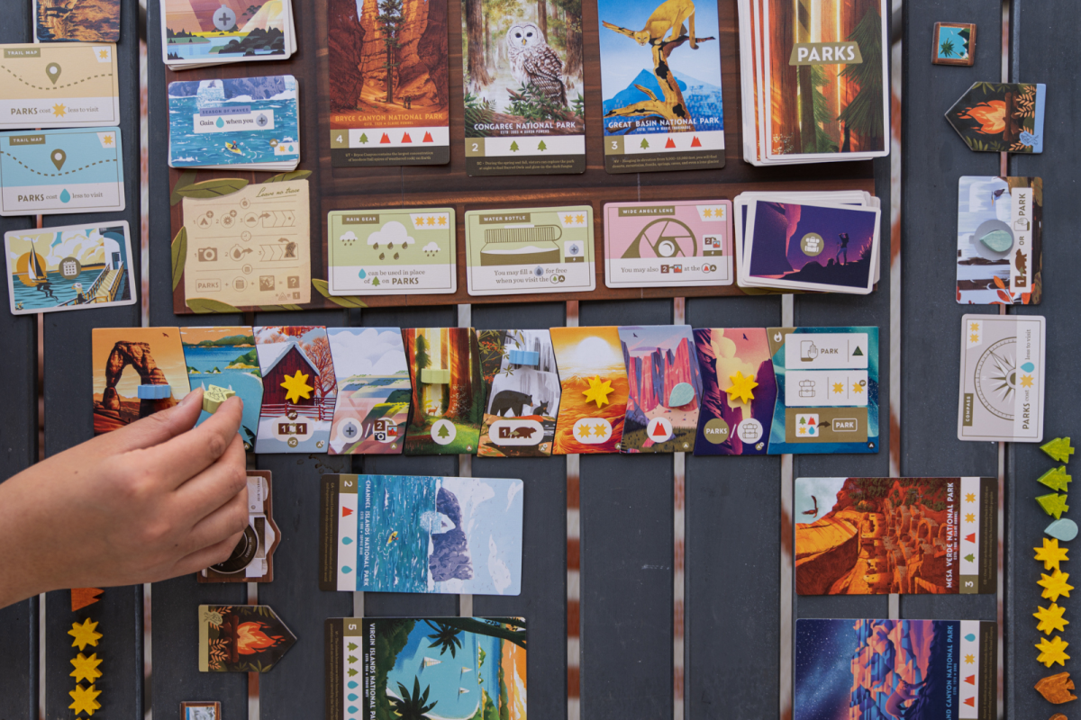 PARKS board game being played on camping table outdoors