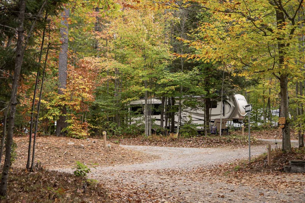 Turning leaves surround an RV at an RV park in New Hampshire. 