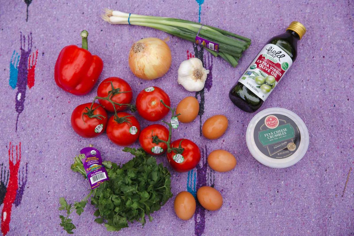 Flat lay of ingredients needed for cooking shakshuka. 