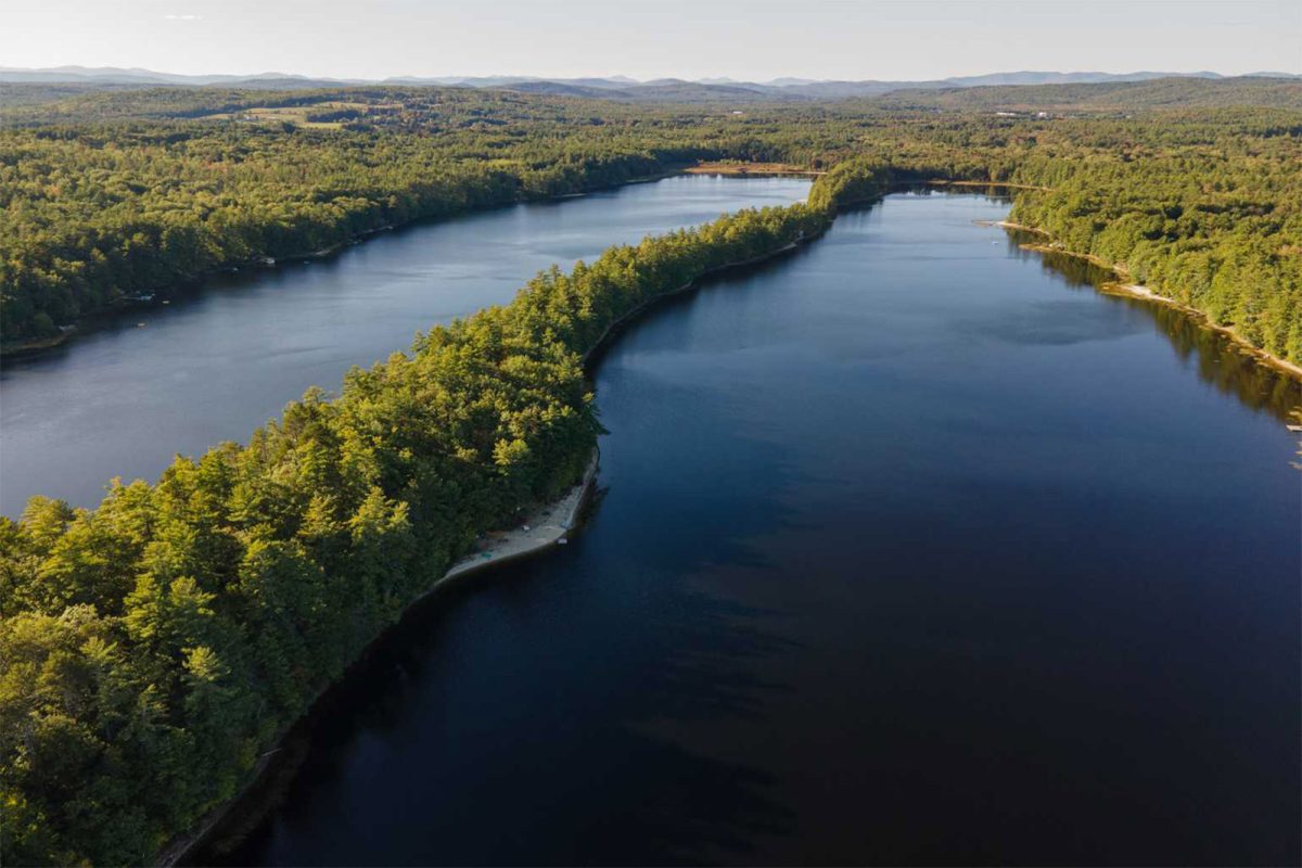 An aerial shot of two bodies of water in Maine near Two Lakes Camping Area, one of the campgrounds on our list of great campgrounds for stargazing. 